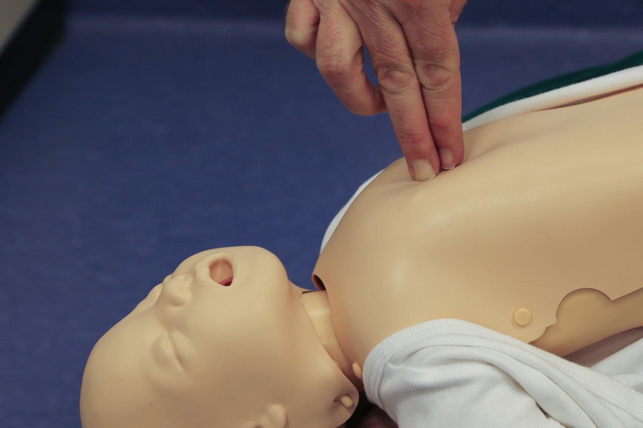baby-chest-compression---cpr Place two fingers in the middle of the baby's chest