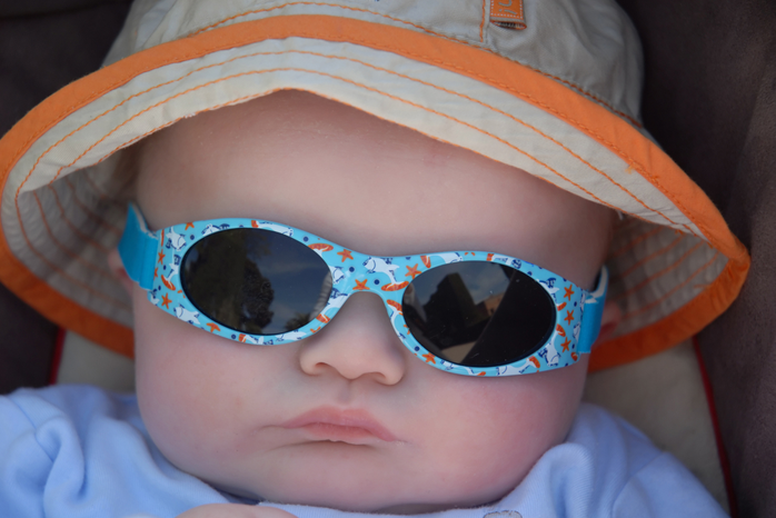 Wraparound sunglasses for children baby-with-wraparound-sunglasses